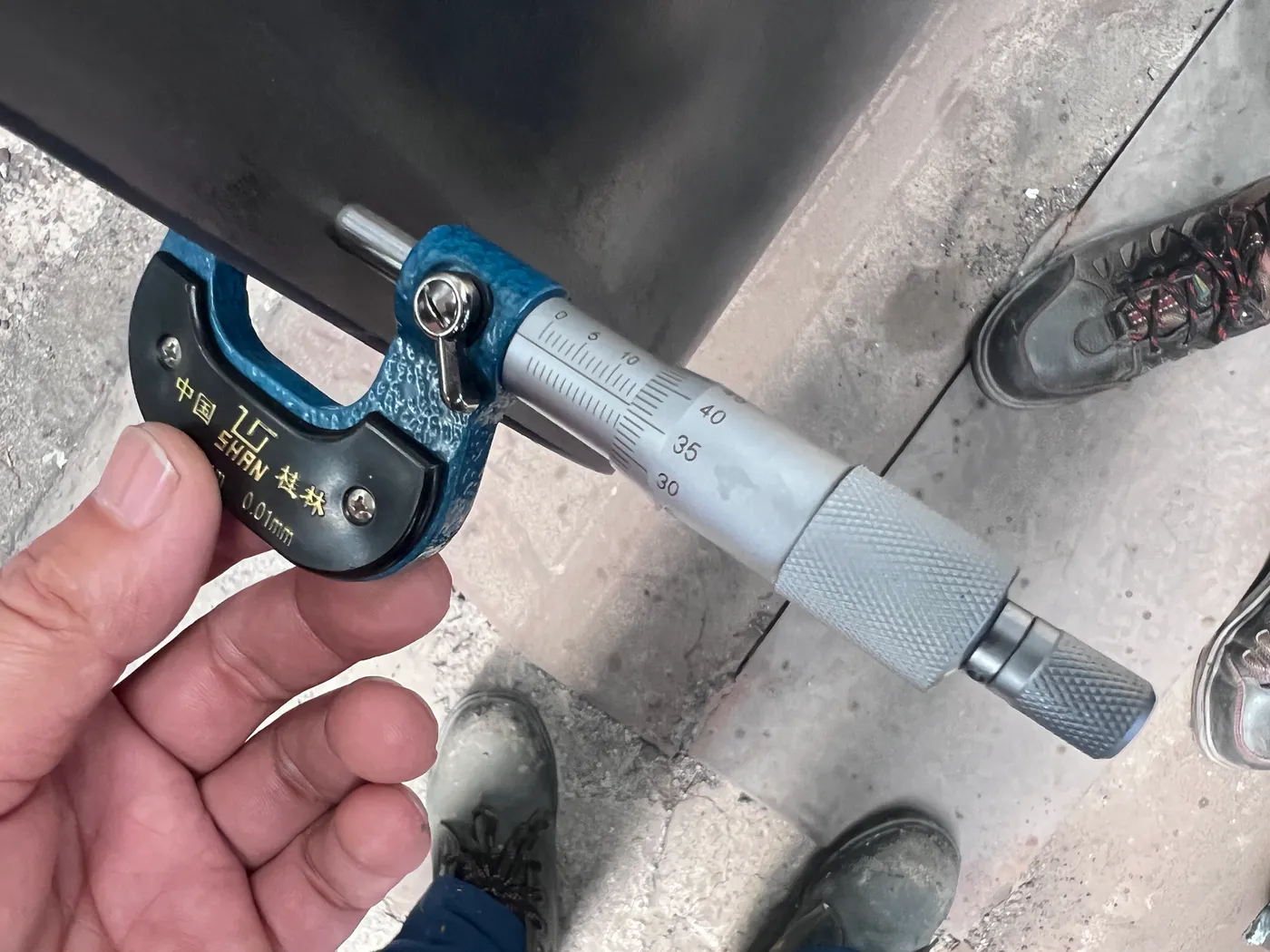 Buyer verifying thickness and specs on site